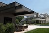 The owners of the Free Float Pool House originally set out to build a traditional cabana in the style of their house, but discovered that a neo-traditional aesthetic prevented it from meeting their goals. The UP Studio's modern design achieves the unobstructed views and flexibility they desired. Photo 6 of Free Float Pool Cabana modern home
