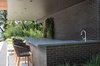The Free Float Pool House's structure shades a covered gathering space with a full service bar. Photo 8 of Free Float Pool Cabana modern home