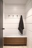 The Free Float Pool House's interior changing room features white wall panels with reveals for visual interest. Photo 12 of Free Float Pool Cabana modern home
