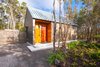 Modern home with Exterior, House Building Type, Metal Roof Material, Cabin Building Type, Wood Siding Material, and Gable RoofLine. Driveway at entry Photo 3 of Kūono at Volcano