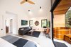 Modern home with Living Room, Chair, Ceiling Lighting, Sofa, and Porcelain Tile Floor. Living space Photo 6 of Kūono at Volcano