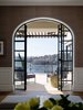 The All Metal Products supplied fine steel windows. The challenge for the builder was to match the curve of the existing archway to the window frames, manufactured in Italy. Photo 8 of Twin Peaks modern home