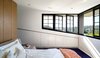 Horizontal openings offer a panorama that spans from Sydney Harbour, across the leafy hills of the Eastern Suburbs: Woollahra, Double Bay, Bellevue Hill and Bondi Junction. All the windows can be opened, outside shutters fold and deep eaves provide ample sun protection.
© Justin Alexander
Photo 17 of Bougainvillea Row House modern home