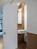 Preparing for a commission to design the new Airbus toilets, Luigi Rosselli Architects have experimented with compact design for such situations with the understairs powder room.
© Justin Alexander
Photo 10 of Bougainvillea Row House modern home