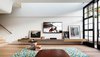 Al Pacino consecrates the Director’s living room from his black TV screen. The concrete seat from the garden continues inside at the same level, metamorphosed into a slim audio-visual unit.
© Justin Alexander Photo 16 of Bougainvillea Row House modern home
