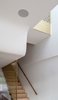 Sculpted ceiling to negotiate the split level and a lightwell over the living room.
© Justin Alexander Photo 14 of Bougainvillea Row House modern home