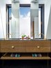 Solid American oak and brass Hafele handles are used in the vanity. Slender mirrors allow plenty of light to bathe in.
© Justin Alexander Photo 20 of Bougainvillea Row House modern home