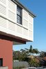The white shuttered first floor overhangs the living room terrace. The bedrooms are kept cool by a combination of the external shutters, cross ventilation and a large air gap in the roof space. The house is air conditioning free.
© Edward Birch Photo 4 of Balancing Home modern home