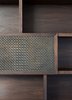 The skilled design of Edward Birch’s joinery intertwines the walnut stained shelving with woven aged brass mesh by Lockers Group.
© Edward Birch
Photo 16 of Balancing Home modern home