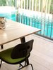 The stained timber louvres of the shutter cast stripy shadows.
© Justin Alexander Photo 13 of The Pool House modern home