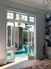 The pool is always present, in this case from the new windows of the play room.
© Justin Alexander
Photo 11 of The Pool House modern home