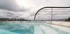 Sydney Harbour’s water continues in the white tiled swimming pool, a glass splash protection screen limits any pool water overflow onto the public beach.
© Edward Birch Photo 4 of Harbour Front-Row Seat modern home