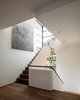 The seven metre tall Lindsey Adelman chandelier dominates the stairwell. Light projectors, concealed in the suspended ceiling, illuminate the artwork.
www.lindseyadelman.com
© Justin Alexander Photo 11 of Harbour Front-Row Seat modern home