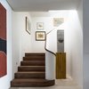 The vertical gallery of paintings terminates at the bottom of the stairs with a sculpture.
© Justin Alexander Photo 13 of Harbour Front-Row Seat modern home