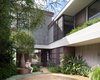 Once a barren parking area, the entry courtyard is now a densely landscaped garden with bottle trees and garden gnomes.
© Justin Alexander Photo 6 of Harbour Front-Row Seat modern home