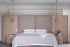 Copper-hued pendants stun in this bedroom, bringing a metallic sheen to natural and matte finishes. When it comes to bedroom lighting ideas for the ceiling, we can’t get enough of this look for both style and functionality. Photo 17 of Sticks & Stones Home modern home