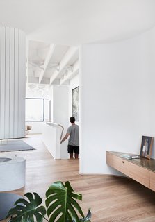 The crisp white walls contrast beautifully with the warm, timber floors, which are Sepia Grande Eterno engineered boards by Tongue N Groove.