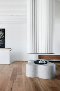 A Roscharch Blotch fireplace is located centrally in the open-place living area. 