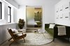 Modern home with Living Room, Coffee Tables, End Tables, Sofa, Ceiling Lighting, and Light Hardwood Floor. Sliding Translucent Glass Doors Between Living and Bedroom Photo of Chelsea Pied-à-Terre