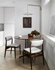 Modern home with Dining Room, Table, Light Hardwood Floor, Pendant Lighting, and Chair. Dining Area Photo 4 of Chelsea Pied-à-Terre