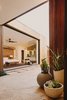 Modern home with Outdoor, Back Yard, Raised Planters, Hardscapes, Desert, and Stone Patio, Porch, Deck. Breezeway to the master bedroom beyond that opens up to the pool courtyard through a pocketing glass door Photo 4 of Curves House