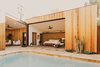 Modern home with Outdoor, Shrubs, Back Yard, Salt Water Pools, Tubs, Shower, Stone Patio, Porch, Deck, Raised Planters, Desert, and Small Pools, Tubs, Shower. Master suite and breezeway off of the pool courtyard Photo 12 of Curves House