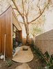 Modern home with Outdoor, Desert, Shrubs, Side Yard, Decomposed Granite Patio, Porch, Deck, Raised Planters, and Stone Patio, Porch, Deck. Office courtyard Photo 14 of Curves House