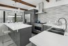 Modern home with Kitchen, Engineered Quartz Counter, Porcelain Tile Floor, Pendant Lighting, Refrigerator, Range, Porcelain Tile Backsplashe, Ceiling Lighting, Range Hood, and Undermount Sink. Kitchen Photo 17 of Schreiber House