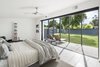 Modern home with Bedroom, Bed, Ceiling Lighting, and Porcelain Tile Floor. Master bedroom opened up to the patio and yard beyond Photo 13 of Schreiber House