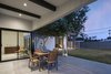 Modern home with Outdoor, Back Yard, Grass, Concrete Patio, Porch, Deck, and Trees. Original patio with a view of the new addition extending beyond Photo 4 of Schreiber House