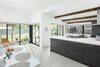 Modern home with Dining Room, Chair, Table, Ceiling Lighting, and Porcelain Tile Floor. Opening up a few walls and adding glass allowed this small midcentury home to live much larger Photo 5 of Schreiber House
