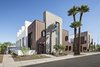 Modern home with Outdoor, Front Yard, Shrubs, Flowers, Trees, Hardscapes, Horizontal Fences, Wall, Decomposed Granite Patio, Porch, Deck, and Concrete Patio, Porch, Deck. Uptown Row sits less than 1000 feet away from a light rail station in uptown Phoenix. This greyfield development adds 10, 3 story single-family attached homes, each with their own private courtyard and roof deck Photo 7 of Uptown Row