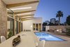 Modern home with Outdoor, Side Yard, Desert, Small Pools, Tubs, Shower, Pavers Patio, Porch, Deck, and Decomposed Granite Patio, Porch, Deck. The courtyard lit up at night with midtown Phoenix beyond. Photo 15 of Sol House