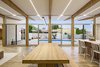Modern home with Dining Room, Table, Bench, Chair, Ceiling Lighting, and Porcelain Tile Floor. Integrated, dimmable LED lighting provides even light throughout the space and extends to the cantilevered patio outside. Photo 12 of Sol House