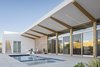 Modern home with Outdoor, Desert, Hardscapes, Small Pools, Tubs, Shower, Side Yard, and Pavers Patio, Porch, Deck. A stairway leads up to a roof deck, inspired by the historic sleeping porches in the area that take advantage of the cold nights to cool off in the desert. Photo 5 of Sol House