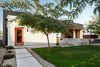 Modern home with Concrete Patio, Porch, Deck, Trees, Ceiling Lighting, Concrete Floor, Grass, Front Yard, and Outdoor. After 2.5 years, we went back to photograph how the house has matured over time. Time is something we try to incorporate into the design of our homes, through the use of specific materials and the form and layout of the home. Photo 11 of Link House