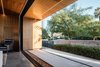 Modern home with Front Yard, Outdoor, Shrubs, and Concrete Patio, Porch, Deck. The extended roof shades the interior of the home from April-October, keeping the home very energy efficient Photo 2 of Link House