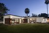 Modern home with Outdoor, Grass, Small Patio, Porch, Deck, and Pavers Patio, Porch, Deck. Mid-century Modern Addition Photo of Modern Manor