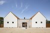 Modern home with Outdoor, Desert, Front Yard, Decomposed Granite Patio, Porch, Deck, Horizontal Fences, Wall, Hardscapes, and Metal Fences, Wall. Street view of the double gable Photo 17 of Canal House