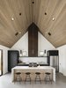 Modern home with Kitchen, Engineered Quartz Counter, Ceramic Tile Backsplashe, Concrete Floor, Ceiling Lighting, Pendant Lighting, Range, Range Hood, Refrigerator, and Undermount Sink. Kitchen with the custom steel hood, Fireclay ceramic tile backsplash in a herringbone pattern, and Dekton counters Photo 8 of Canal House