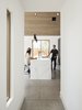 Modern home with Kitchen, Engineered Quartz Counter, and Pendant Lighting. Waterfall edge on the Dekton counter. The floors are exposed aggregate concrete Photo 11 of Canal House