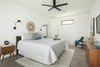 Modern home with Bedroom, Bed, Dresser, Night Stands, Chair, Concrete Floor, Ceiling Lighting, and Wall Lighting. Master Bedroom Photo 7 of Canal House