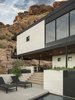 Modern home with Exterior, Flat RoofLine, House Building Type, and Stone Siding Material. Led lit steps lead from the pool up to the grill area and outdoor shower beyond Photo 13 of Red Rocks