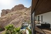 Modern home with Outdoor, Desert, Front Yard, Slope, Large Patio, Porch, Deck, Infinity Pools, Tubs, Shower, Small Pools, Tubs, Shower, Wood Patio, Porch, Deck, Decking Patio, Porch, Deck, and Boulders. View from the new 2nd story deck down to the pool hugged by Camelback Mountain Photo 15 of Red Rocks