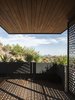 Modern home with Outdoor, Decking Patio, Porch, Deck, Raised Planters, Desert, Wood Patio, Porch, Deck, and Rooftop. The addition was designed to pull the homeowner out of the house and to highlight specific views such as the Papago buttes Photo 17 of Red Rocks