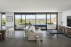 Modern home with Living Room, Ottomans, Sofa, Concrete Floor, and Chair. Rearranging the house plan was a priority to provide views such as this throughout the house Photo 20 of Red Rocks