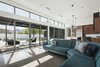 Modern home with Living Room, Sectional, Recessed Lighting, Concrete Floor, and Pendant Lighting. Aluminum clad, wood sliding doors and clerestory windows bring natural light into the great room Photo 11 of Pleats