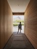 Modern home with Exterior, Flat RoofLine, House Building Type, Wood Siding Material, Stucco Siding Material, Gable RoofLine, and Metal Roof Material. The entry recessed entry frames the mountain to the north Photo 5 of Pleats