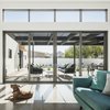 Modern home with Living Room, Concrete Floor, Sectional, and Recessed Lighting. A favorite spot for the rescue dogs in the morning is along the window wall, taking in the filtered sun and mountain views to the east Photo 12 of Pleats