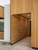 Modern home with Exterior, Stucco Siding Material, House Building Type, Flat RoofLine, Gable RoofLine, Metal Roof Material, and Wood Siding Material. The recessed entry features a disguised door for guests Photo 3 of Pleats